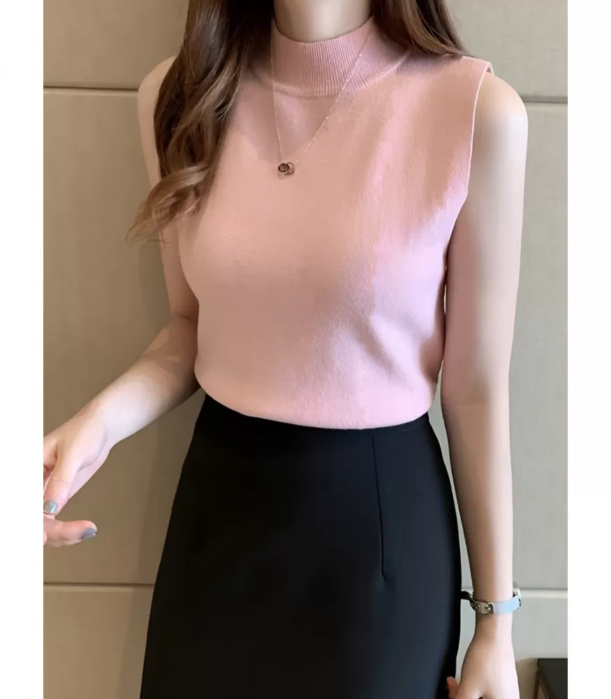 Vaaleanpunainen korkeakauluksinen neuletoppi